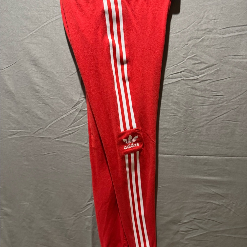 Adidas women’s Red Joggers with White Stripes